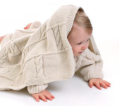 Tricoter une couverture pour enfants avec des aiguilles à tricoter